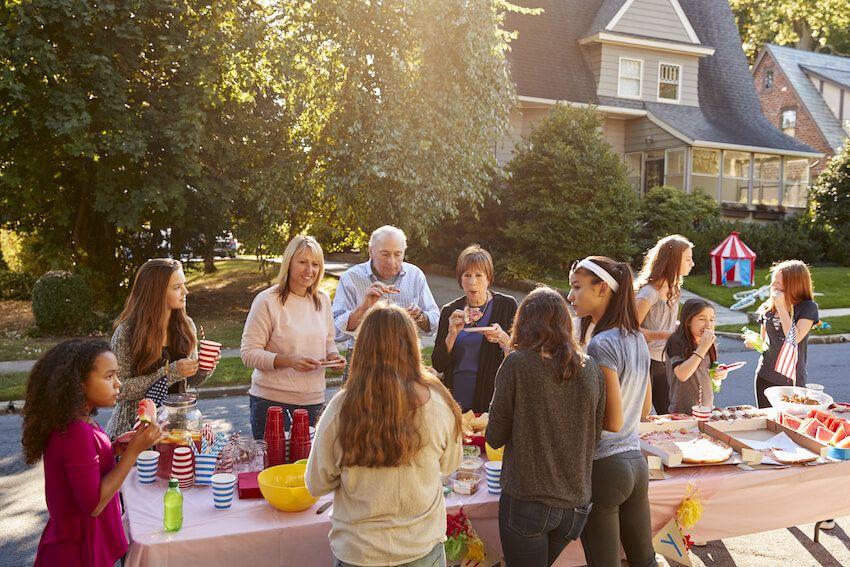 Block party ideas: neighbors eating outdoors