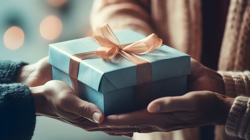 Gender neutral gifts: people holding a gift